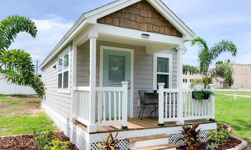 Beautiful grey tiny home with cute front porch