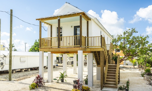 Beautiful white small home on large stilts