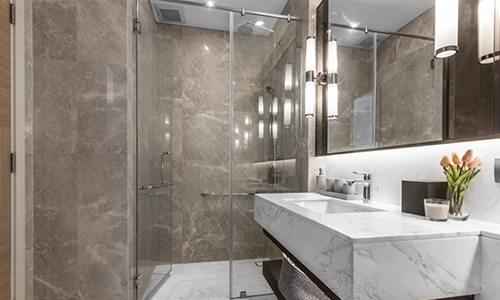 Beautiful floating sink with granite countertop in a bathroom remodel