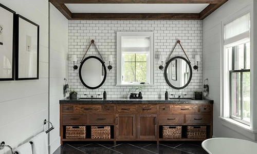 Beautiful custom double sink with dark brown wood cabinets in a modern bathroom remodel