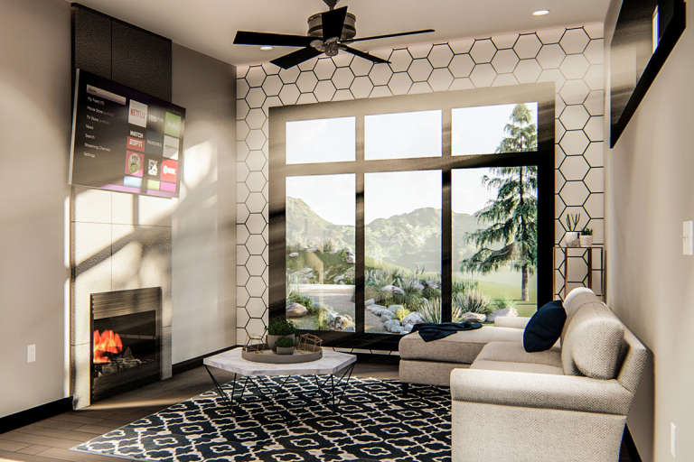 Modern interior of a tiny home with large windows in the living room.