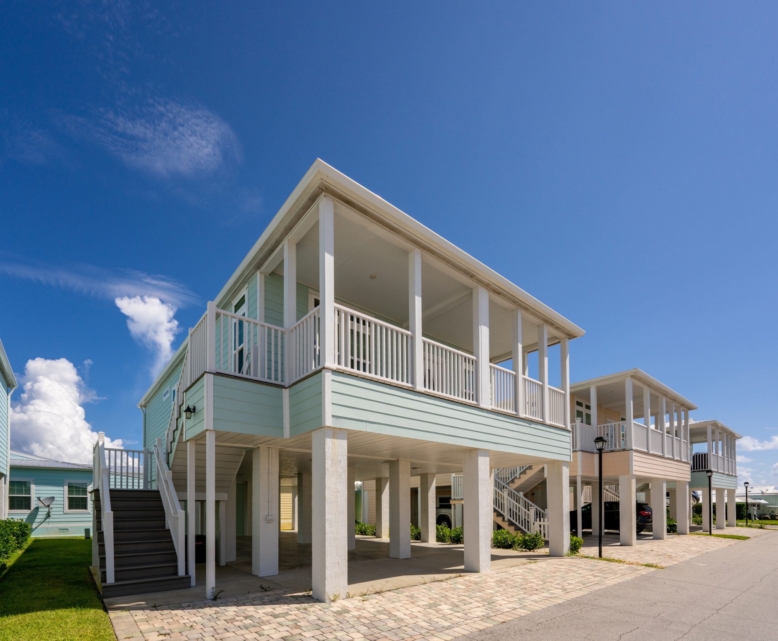 Upscale manufactured home elevated on stilts.